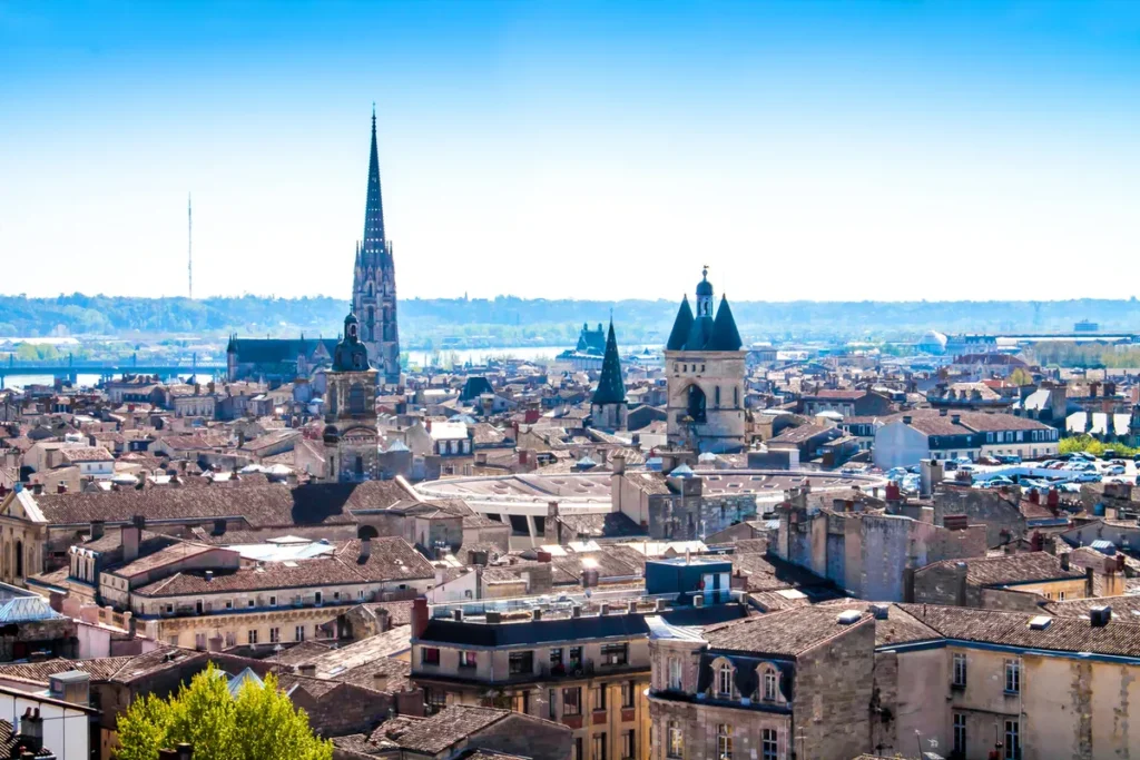 A Traveler’s Guide to Bordeaux’s Best Places Scenic view of Bordeaux with historic architecture and vineyards