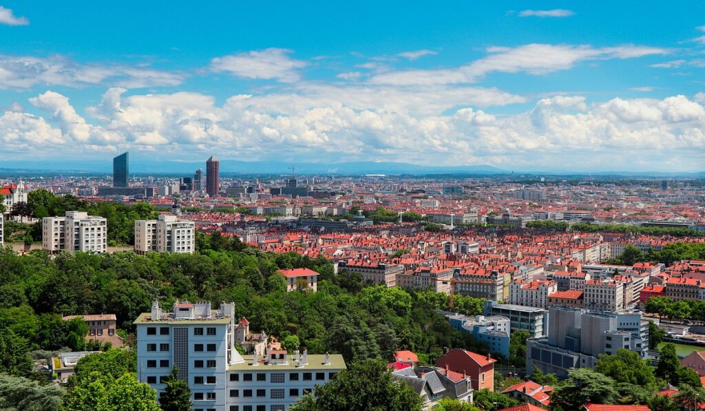 Top Things to Do in Lyon Panoramic view of Lyon's historic buildings and the Rhône River in France.
