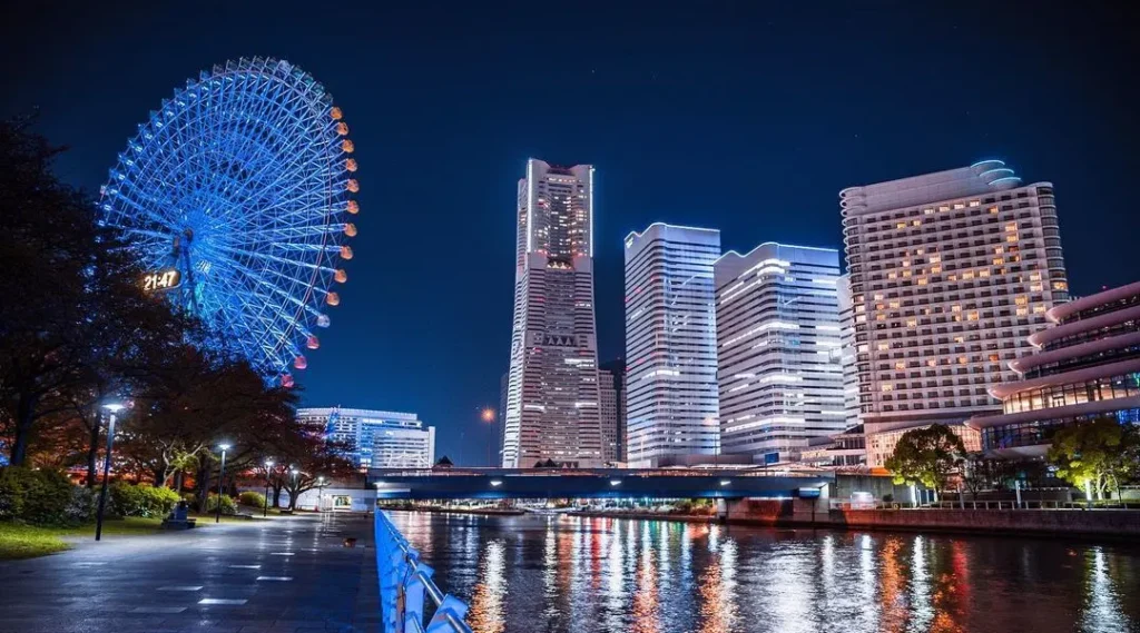 Famous Places to Visit in Yokohama for a Memorable Experience Yokohama skyline featuring Minato Mirai, Ferris wheel, and waterfront at sunset