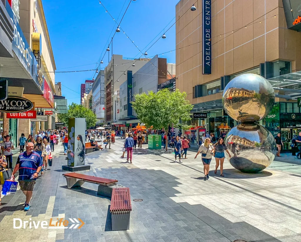 Top-Rated Things to Do in Adelaide for Every Traveler Adelaide cityscape featuring iconic landmarks and lush vineyards
